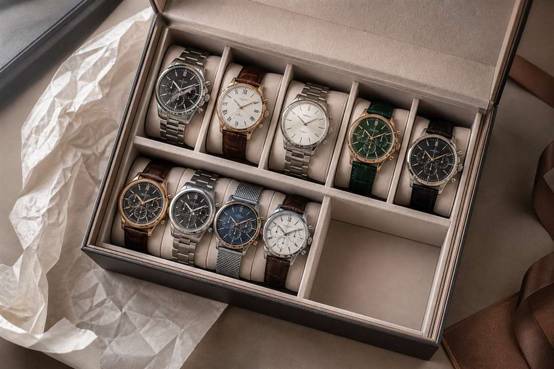 Spaced watch box compartments providing access between neighboring watches
