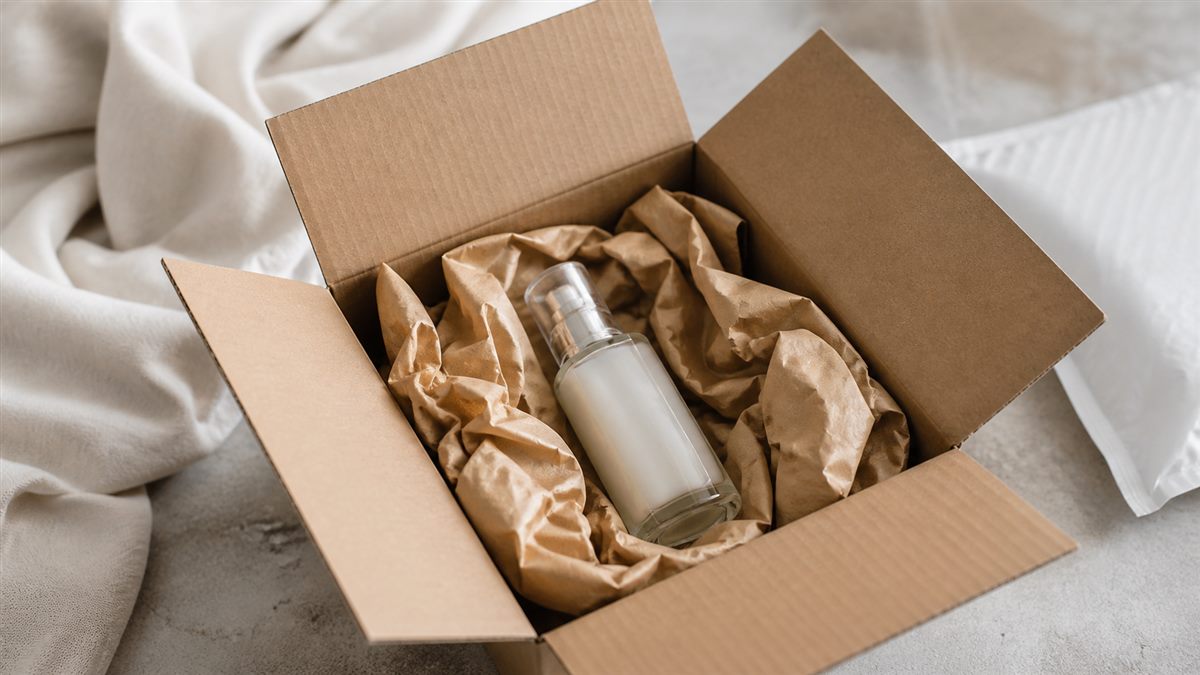 E-commerce shipping box with a generic product protected by paper cushioning.