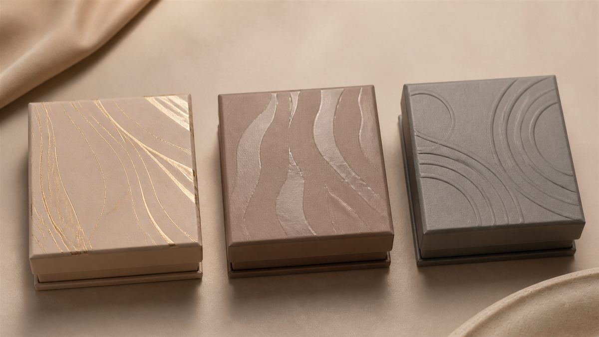 Jewelry box lids showing restrained hot stamping, spot UV, and embossing
