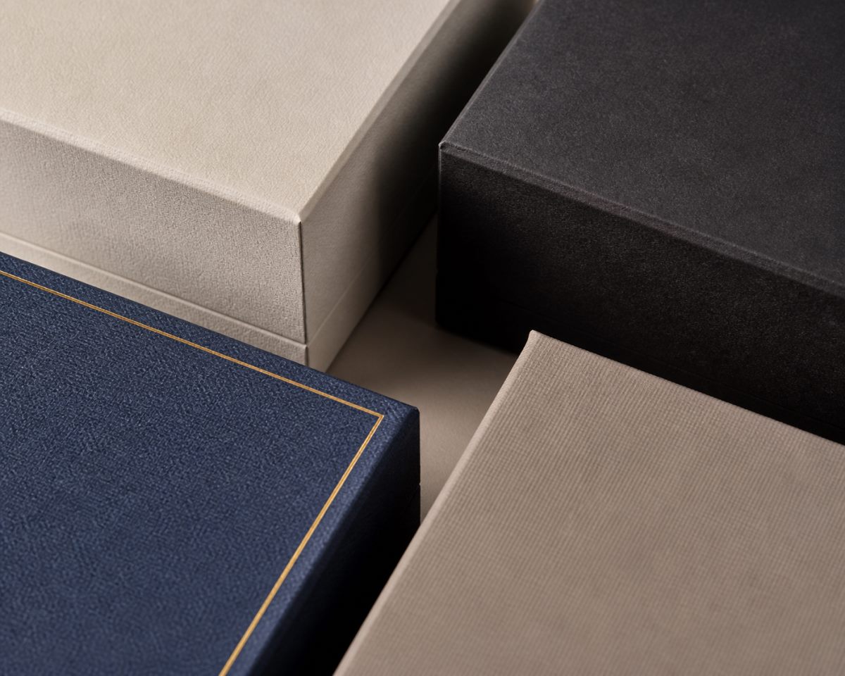 Unbranded jewelry box exterior samples showing varied subtle surface finish details.