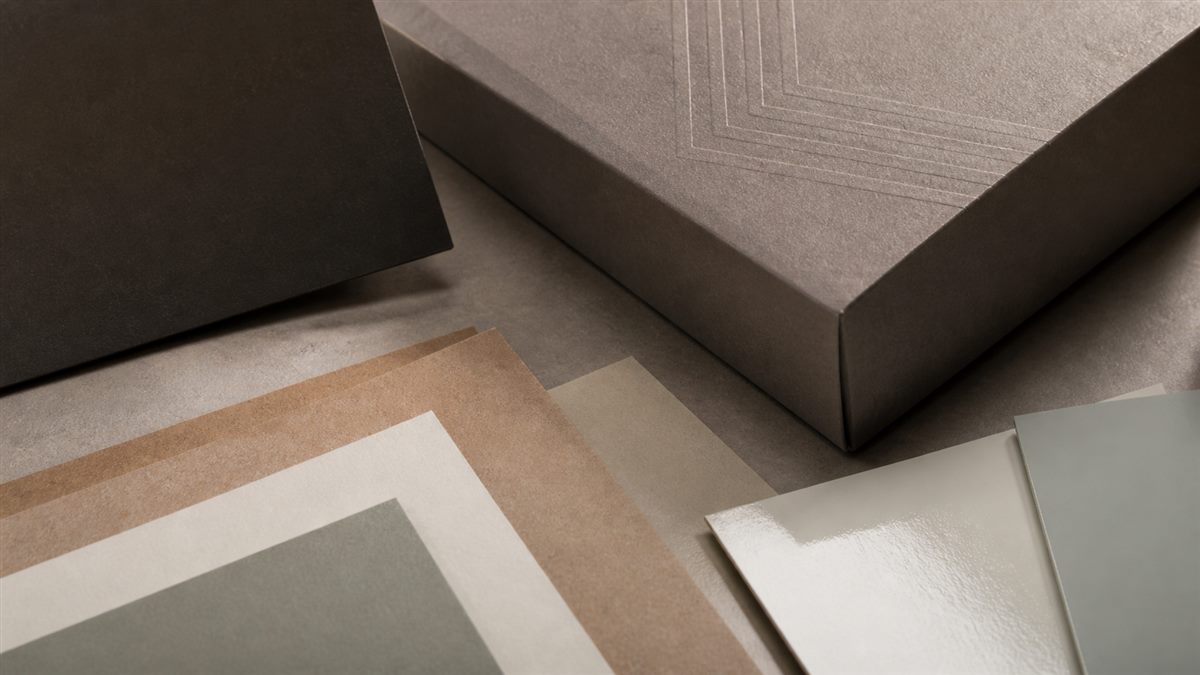 Paper packaging samples showing material and finish texture differences