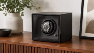 Open watch winder box holding two automatic watches