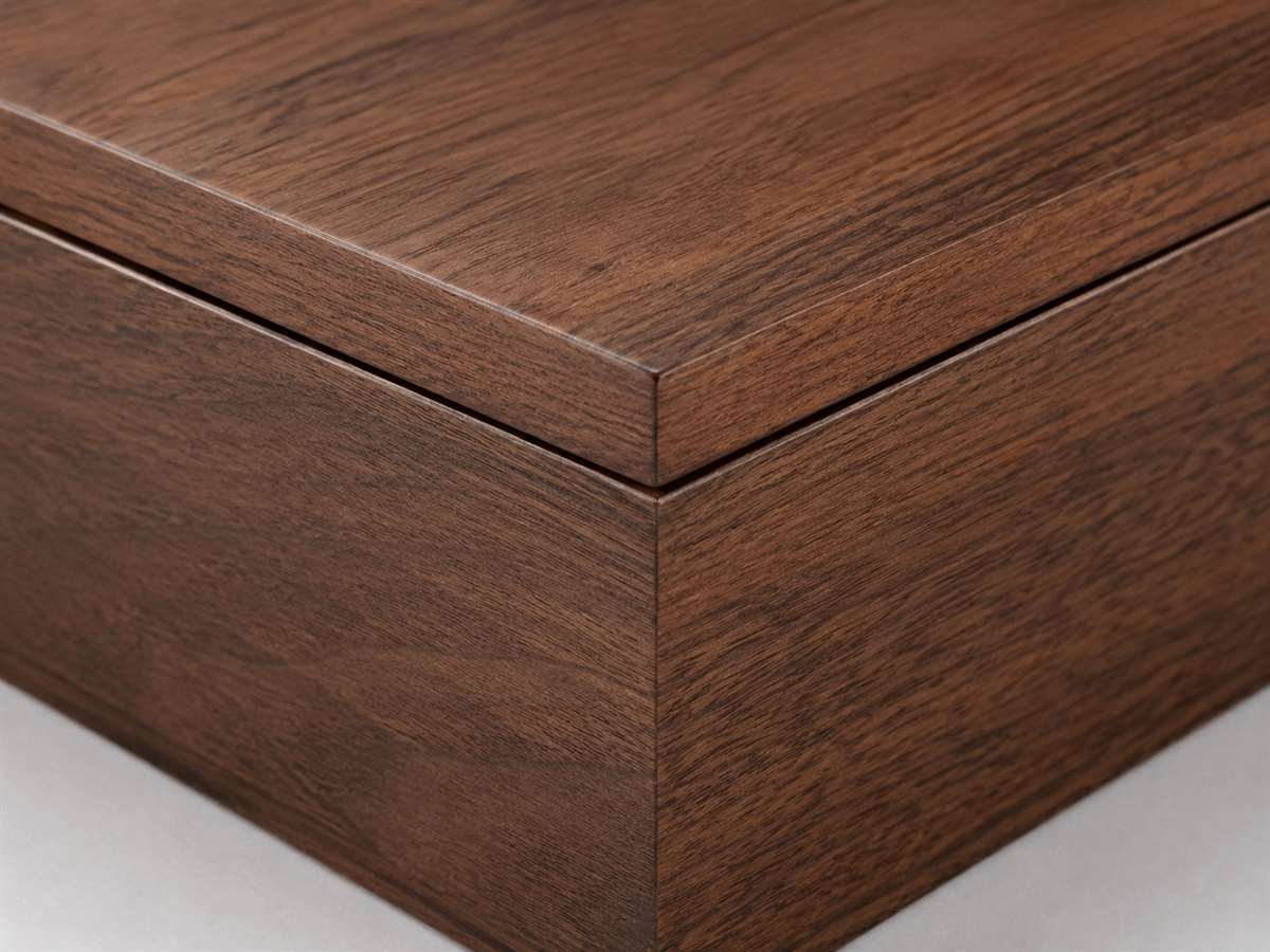 Close-up of a wooden humidor lid seam and aligned corner