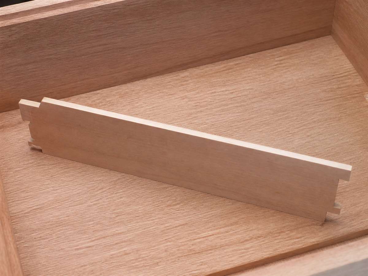 Unfinished wood lining and removable divider inside a humidor