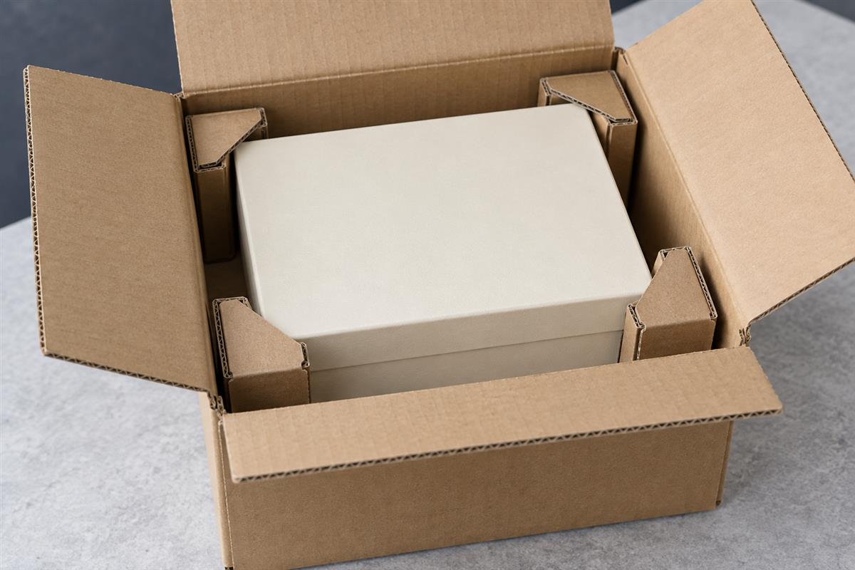 Gift box supported inside a corrugated shipping carton