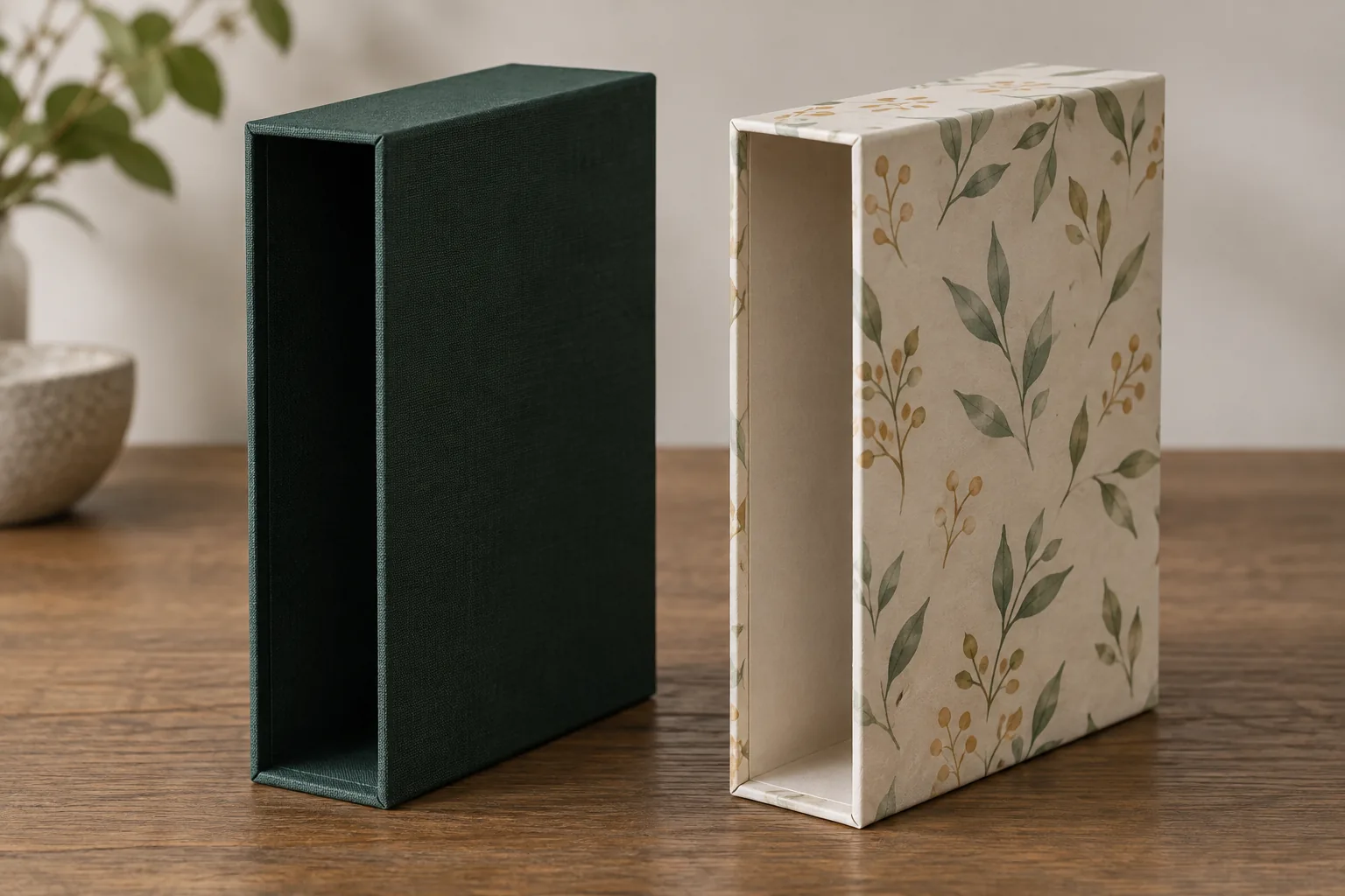 Green cloth and botanical paper wrapped slipcase samples