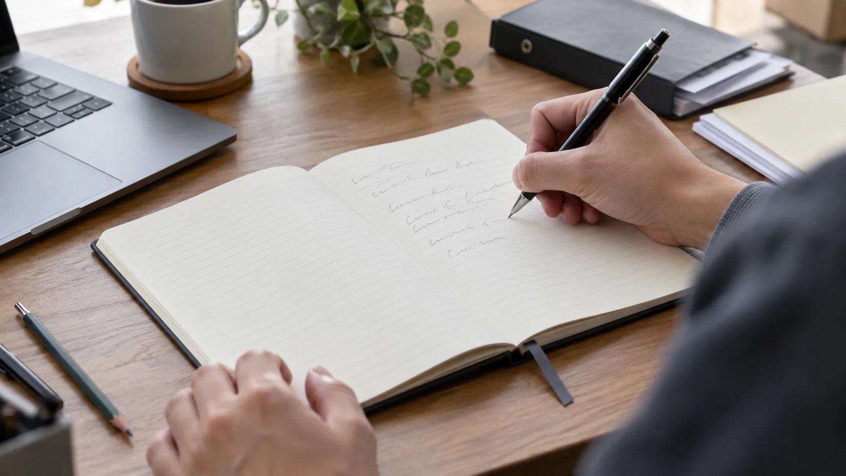 Unbranded notebook with a writing-oriented page used on an office desk